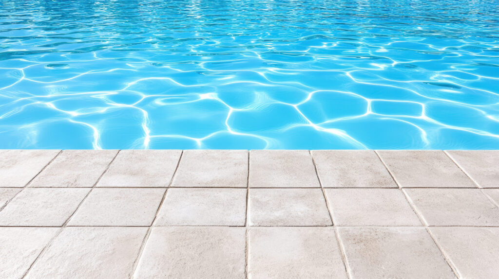 Pool deck tiles surrounding a swimming pool, highlighting wet-area performance and slip resistance in Malaysia