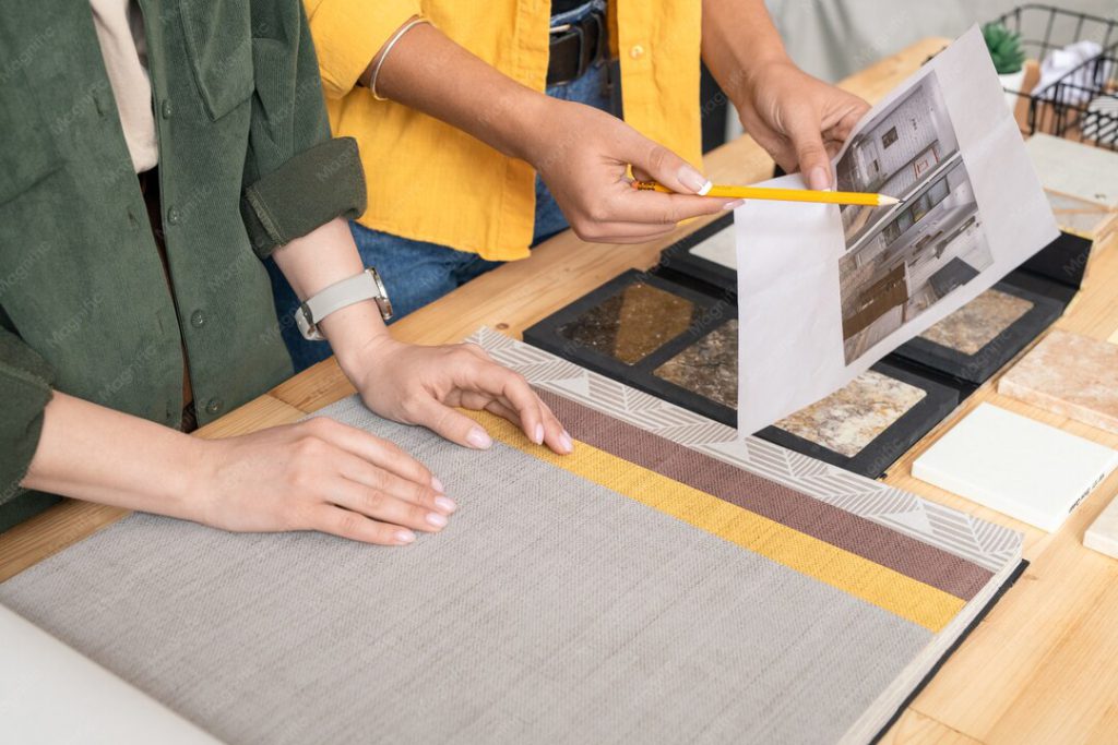 Project team reviewing ceramic tile samples for project selection.